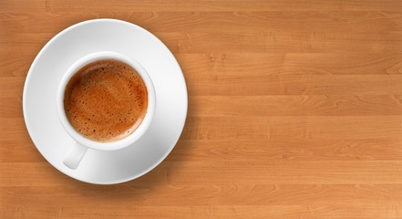 Coffee cup on wooden desk