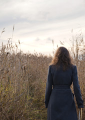 woman walking in autumn field