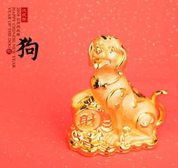 golden dog statue on red paper,translation of calligraphy: good Fortune for year of the dog,red stamp: year of the dog,2018 is year of the dog.
