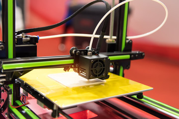 3D printer or additive manufacturing and robotic automation technology.