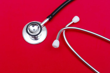 Stethoscope Over Red Background
