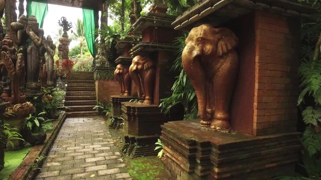 statues of elephants in a park in Asian style