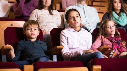 People enjoying film screening in cinema