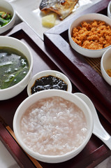 Traditional chinese rice porridge on dinner table  