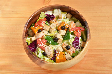 Bowl of delicious and healthy caesar salad  