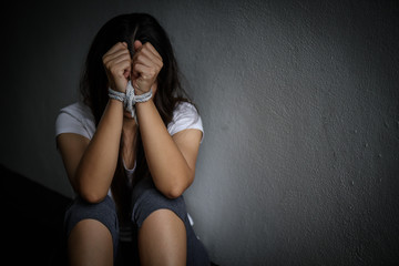 Woman hand were tied with a rope. Stop Violence, Terrified, Human Rights Day concept.