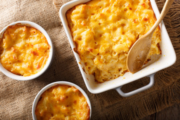 Delicious mac and cheese in a baking dish close-up on a table. horizontal top view