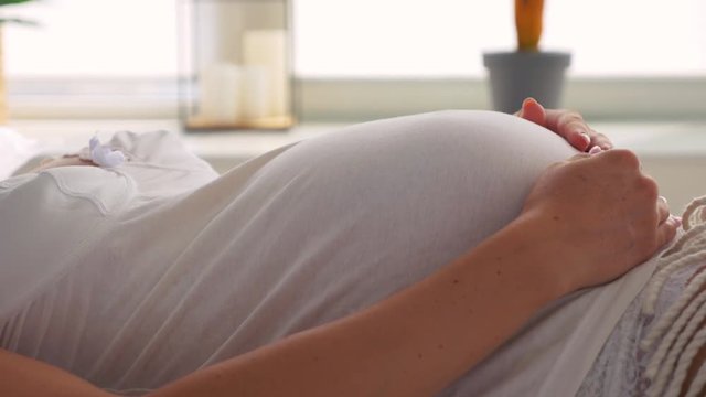 Baby moving inside belly of pregnant woman