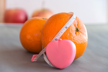 orange with Tape measure.health concept
