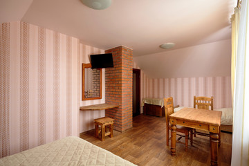 Rural Hostel Room with Brick Chimney and TV