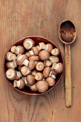 Portobello mushrooms in a wooden bowl
