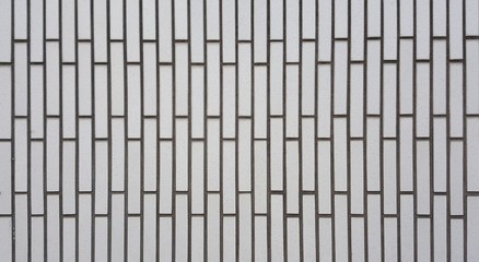 Wall tiles white color are rectangular in shape.square background