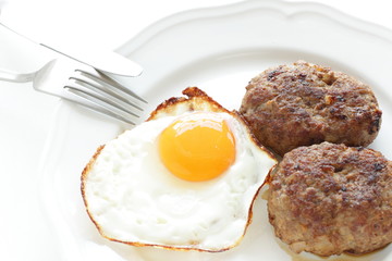 Sunny side up fried egg and patty