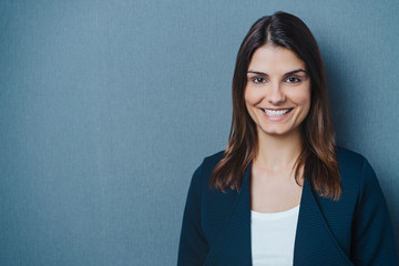 Friendly young businesswoman with a beaming smile