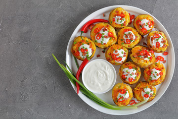 baked potato halves on white platter