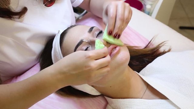 Young pretty woman receiving treatments in beauty salons. 