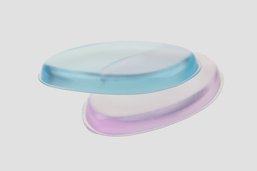 Two silicone sponge pink and blue natural spa on a gray background