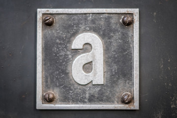 letter A on metal sign on metal background