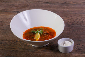 Solyanka soup with lemon