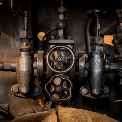   old  technology concept - valves, taps and pipes closeup