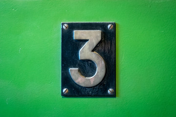 number 3 sign - number three metal sign on green background