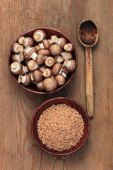 Organic dry Kamut Berries Grain in a Bowl, mushrooms Portobelo
