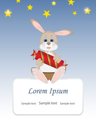 Cute rabbit shorts sitting,holding in paws a big candy