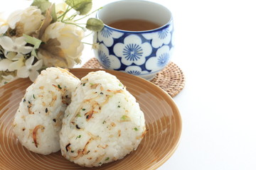 Japanese food, spicy small sardines shirasu in rice ball and tea