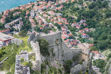 Obraz premium Aerial view from walls of St John Fortress in Kotor with Dobrota town on background, Montenegro