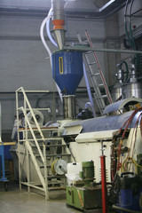 factory shop production of polyethylene film mechanisms machine tools lifting mechanism wires hoses switches pressure gauges pressure temperature molten mass work place enterprise