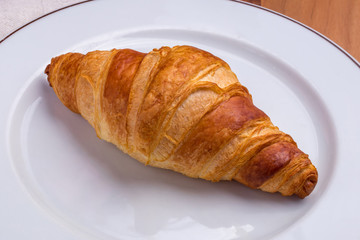 The classic croissant on a white plate