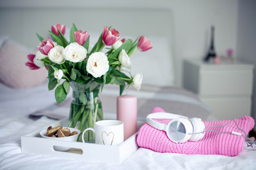 Romantic breakfast in bed. Bouquet of flowers. Roses and tulips. Spring. Valentine's Day. International Women's Day. Cozy.