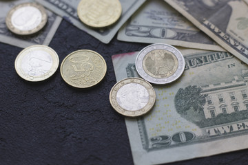Coins and paper United States money on the table. Euro coins. USA money. Euro currency. Money concept. Closeup