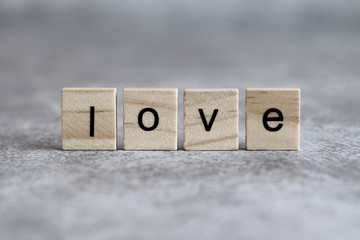 Love word written on wood cube
