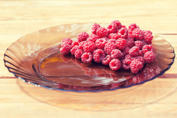 Raspberry on a glass plate