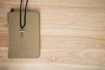 christian cross on wood background