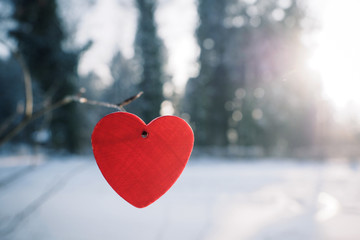 Red heart and winter snow scene background