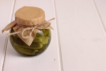 pickles jar on white wood background