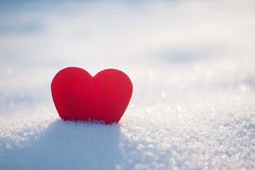 Red heart and fresh winter snow background