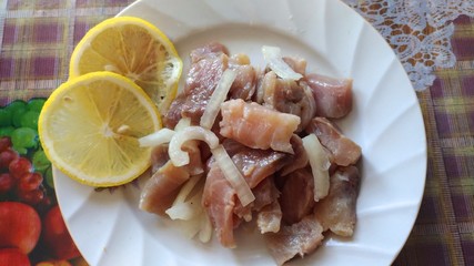 fish, seafood, lemons, plate, meal on a plate, tasty, healthy, salty, ready-to-eat, fish with lemons on a white plate,