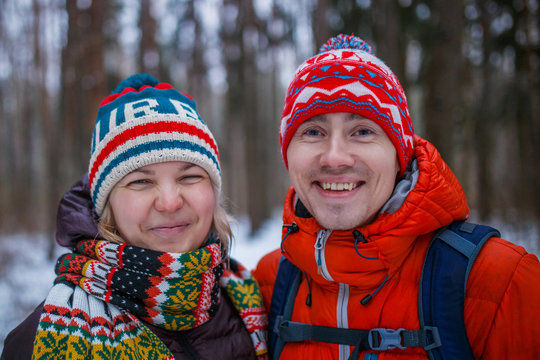 Image of happy couple on walk in winter forest