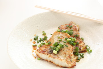 Chinese food, pan fried white fish and scallion