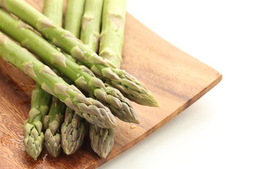 Freshness green asparagus on wooden plate