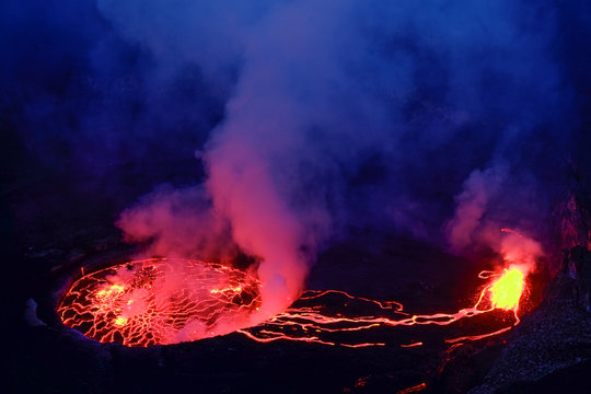 Lava and steam in crater of Nyiragongo volcano in Virunga National Park in Democratic Republic of Congo, Africa