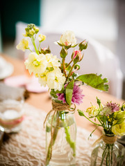 the small table decoration with wildflowers, natural and subtle, wedding and summer party