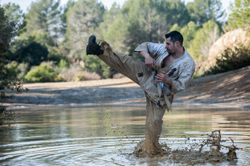 man practicing karate in the field