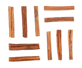 Cinnamon sticks isolated on white background. Top view