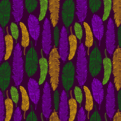 Hand drawn seamless pattern of feathers. Mardi gras color. © olga_milagros