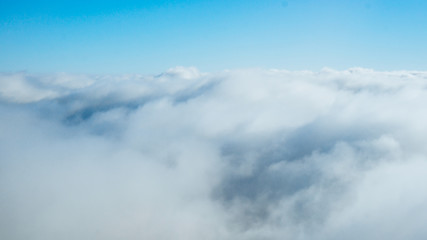 Fototapeta premium clouds from airplane window. View of the sky above the clouds