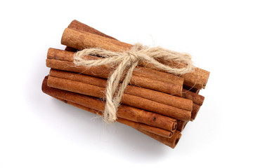 Cinnamon sticks bunch isolated on white background. Top view